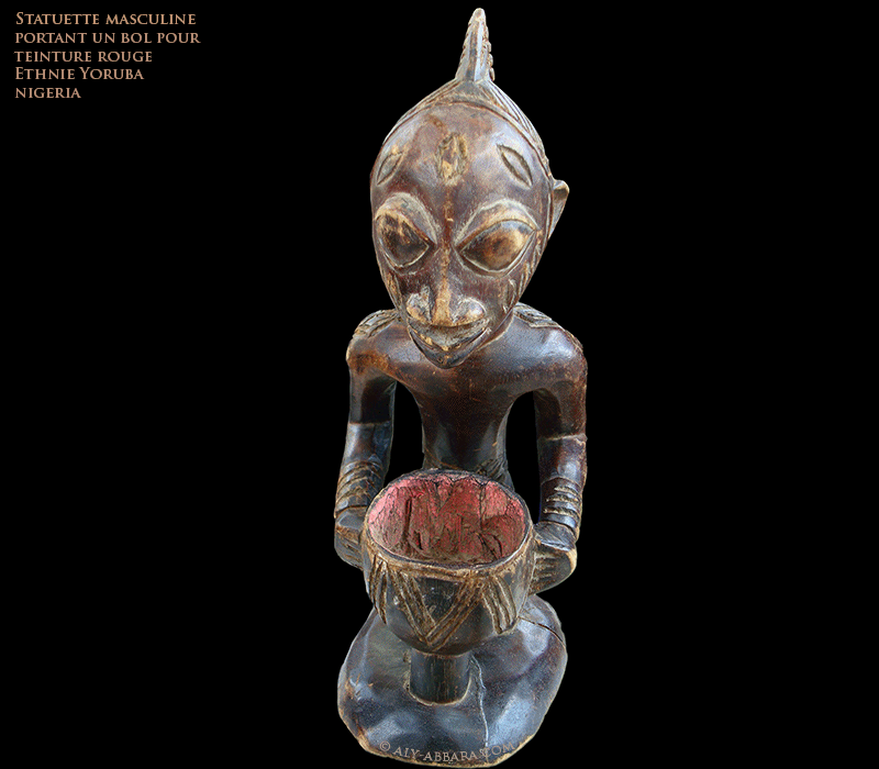 Statuette d'homme portant un bol pour teinture rouge - Sculpture de l'ethnie Yoruba