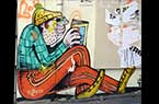 Art mural parisien - Homme lisant son journal